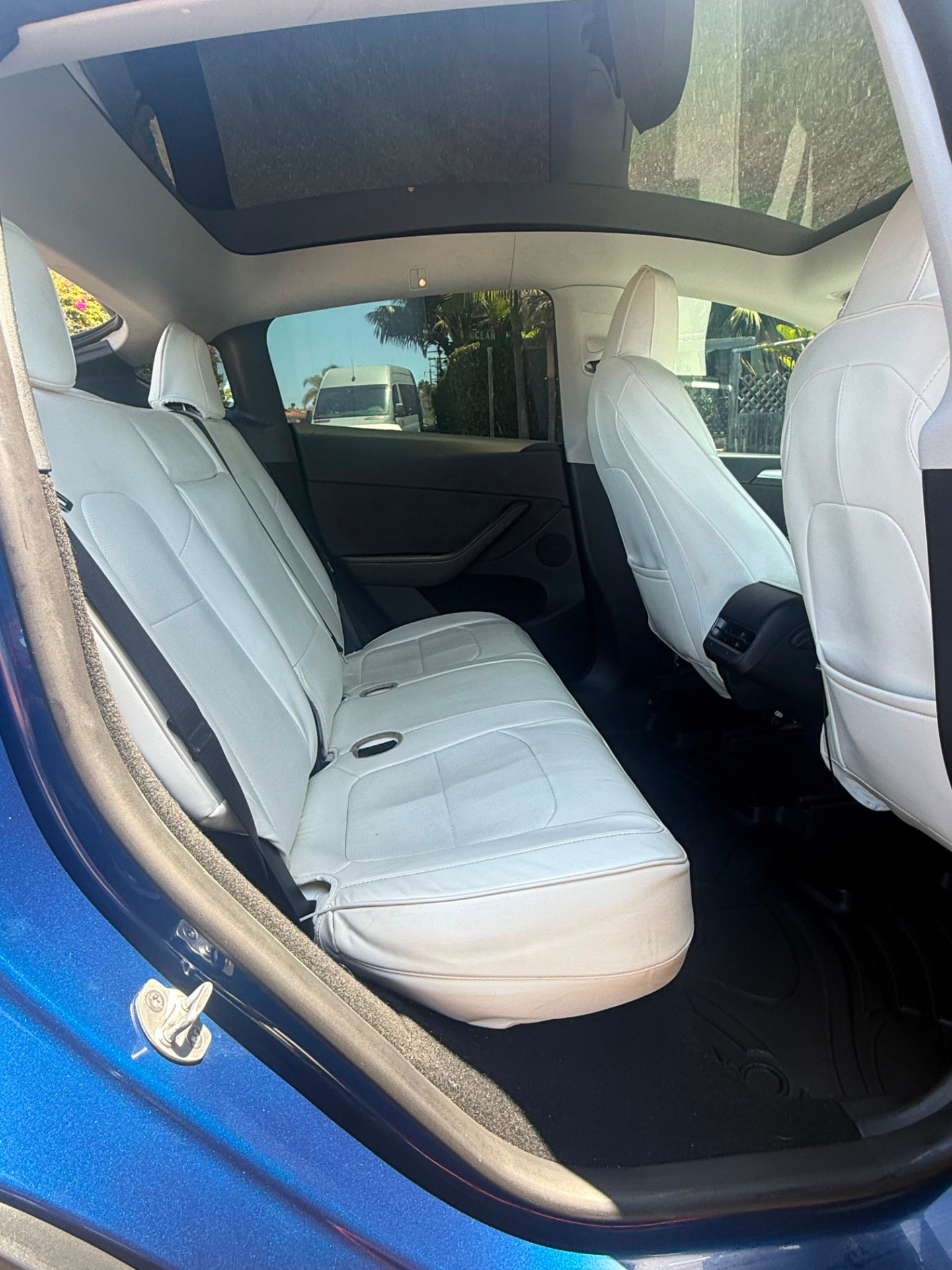 Spacious white leather rear bench of the Tesla Model Y