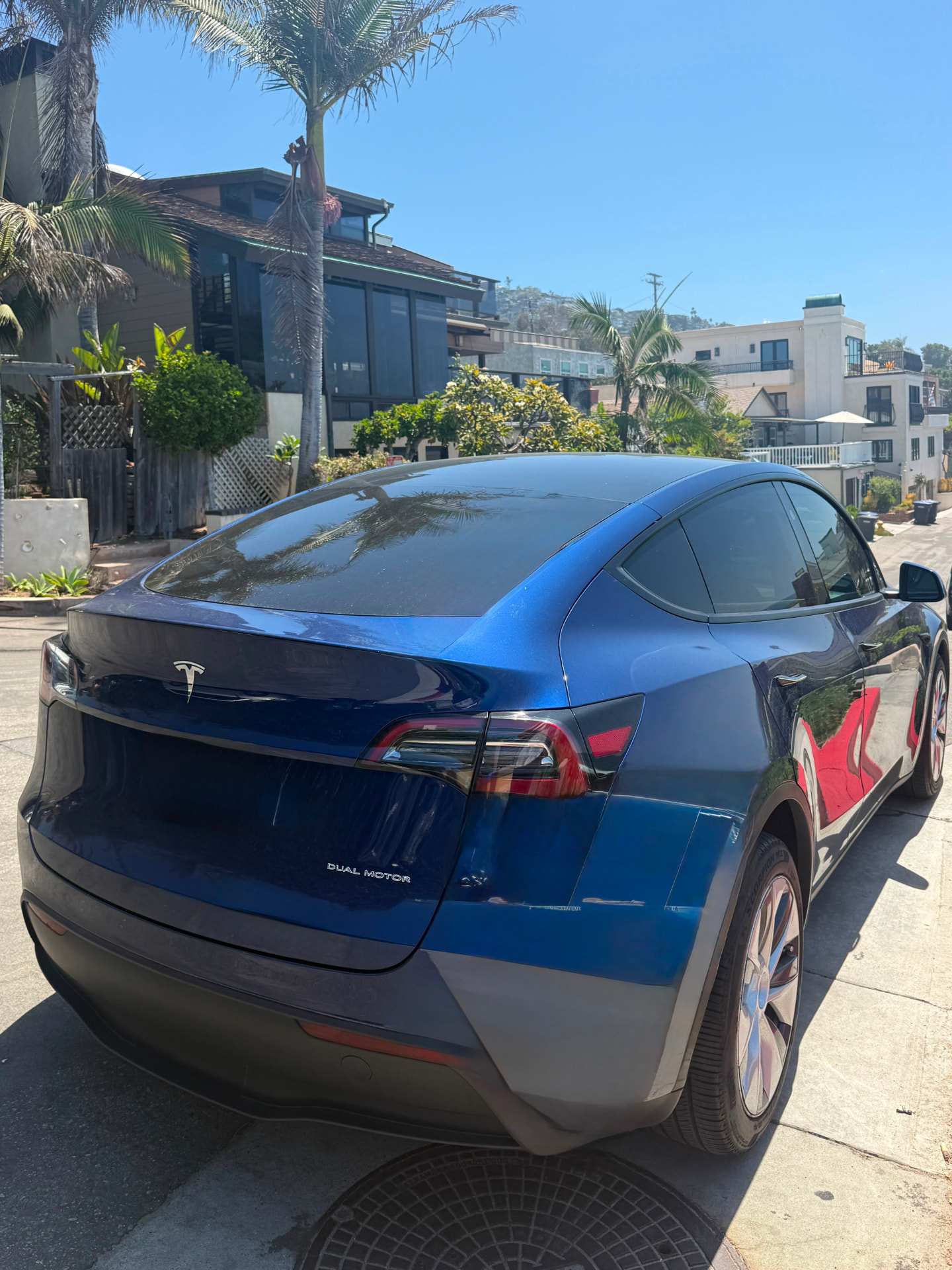 Rear view of the blue Tesla Model Y Dual Motor